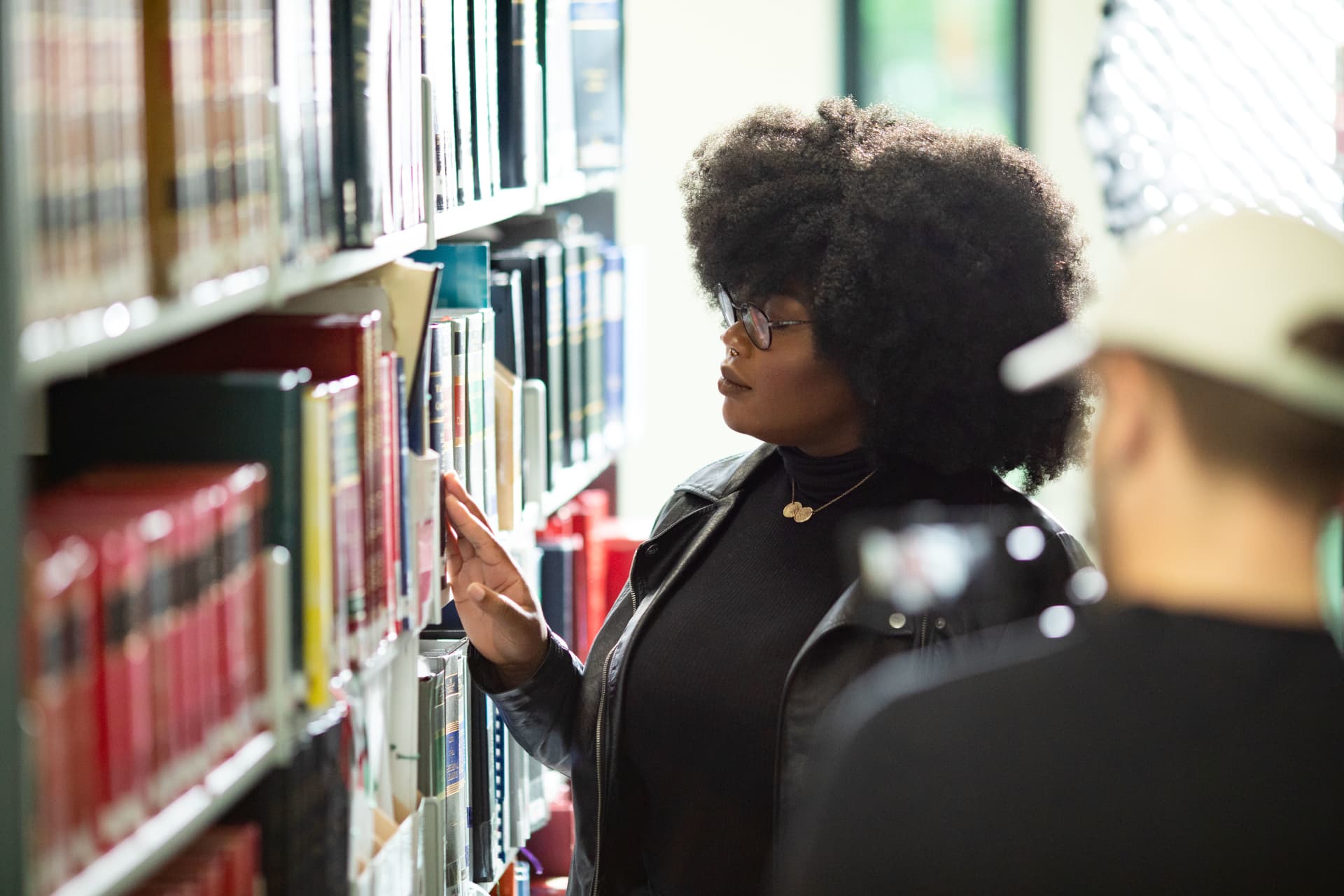 Dr Mamobo Ogoro reading in a library